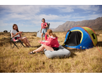 Three women camping with a CRIVIT tent and a CRIVIT Camping Air Bed in a field.