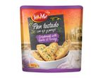 Crispbreads with garlic and parsley in a bag, with a rustic background and garlic cloves.