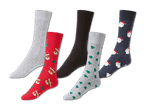 Fünf Paar Socken, darunter einfarbige, mit Rentieren, Weihnachtsbäumen und Weihnachtsmännern.