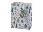 Christmas gift bag with a festive pattern of trees, berries, snowflakes, and deer.