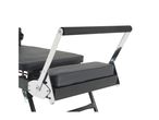 Close-up of a black padded exercise bench with chrome-plated armrests