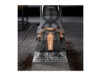 A Tower Aquajet Plus carpet cleaner is shown cleaning a dark carpet with dirt.