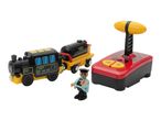 A toy train with a remote control and a conductor figurine on a white background.