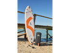 Crivit paddleboard, bag, and accessories on the beach.