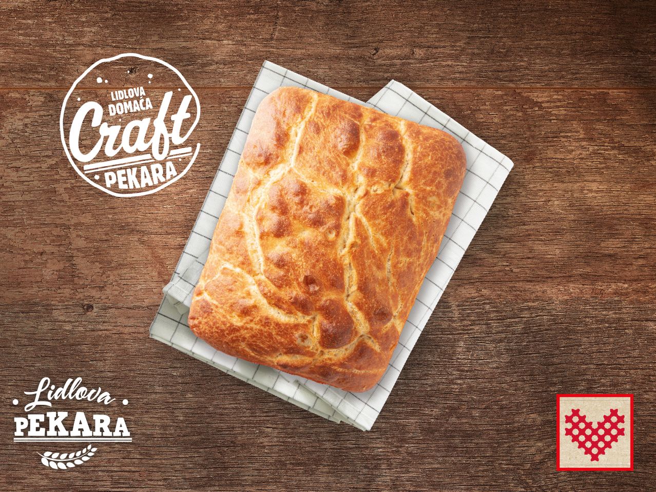 Lidl domaći kruh 'Craft Pekara' na drvenom stolu.