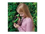 Child using a green and black handheld microscope to examine a leaf.