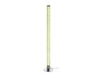 Tall, cylindrical floor lamp with a chrome base, emitting a soft green and yellow light.