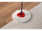 A Vileda microfiber mop cleans a wooden floor.