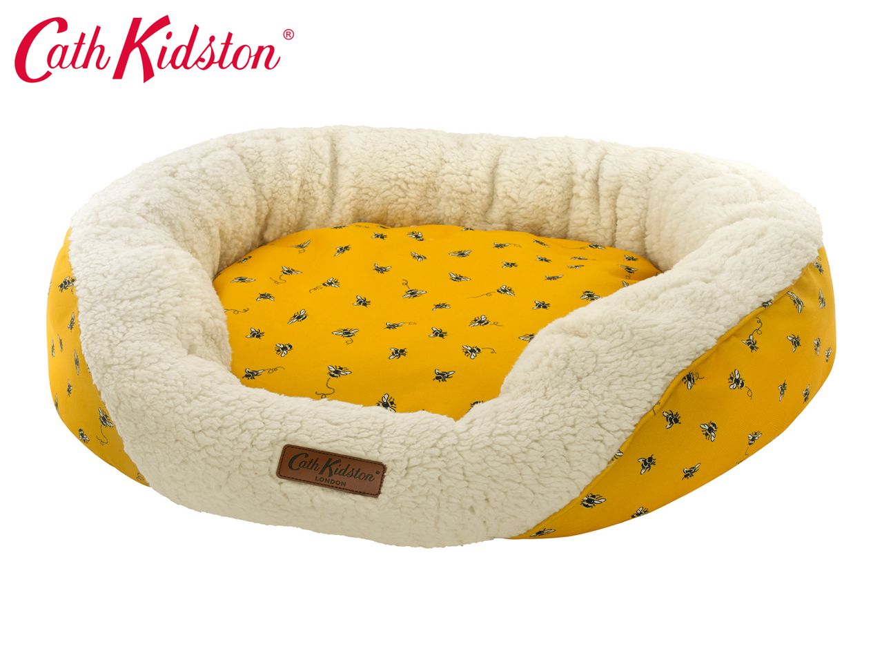 Cath Kidston yellow pet bed with a bee pattern and a cream fluffy interior.