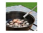 Barbecue with glowing charcoal briquettes being lit by a charcoal starter.