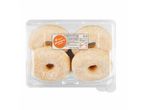 Four packaged sugared donuts.