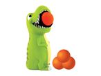 Green dinosaur toy with an orange ball in its mouth, with three more orange balls nearby.