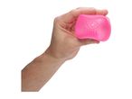 A hand holding a pink stress ball with the words 'Nee Doh' embossed on it.