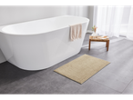 LIVARNO home bath mat on gray tiled floor next to a white bathtub