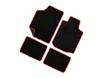Black car floor mats with red trim.