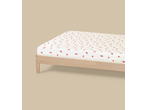 Livarno Jersey Fitted Sheet with watermelon pattern on a wooden bed frame.