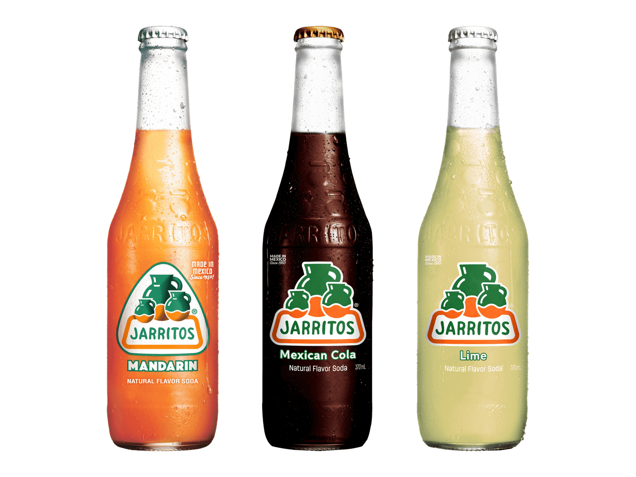 Kolme Jarritos-virvoitusjuomapulloa: mandariini, meksikolainen kola ja lime.
