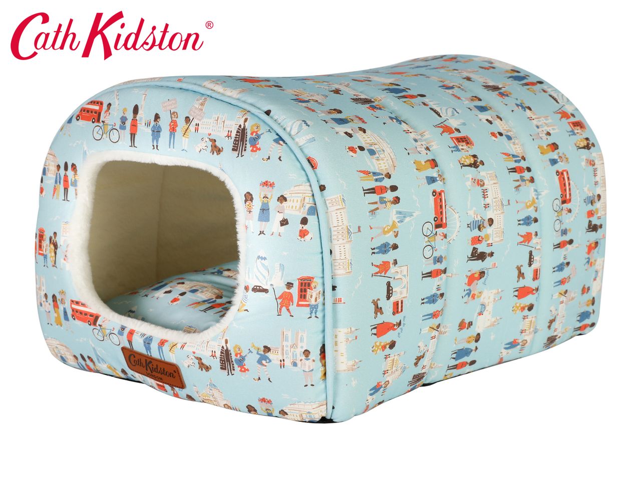 Cath Kidston pet bed with a London-themed print featuring people, buses, and landmarks.