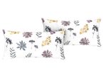 Two white pillows with a watercolor floral pattern in purple, yellow, and gray.