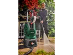 PARKSIDE pressure washer and man cleaning a patio