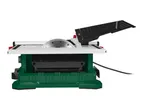 Table saw with a silver blade and a black protective cover on a green base.