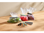 SILVERCREST® Sealing Clips in various colors, sealing bags of fresh produce.