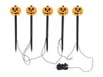 Five Halloween pumpkin pathway lights with black stakes and a control box.