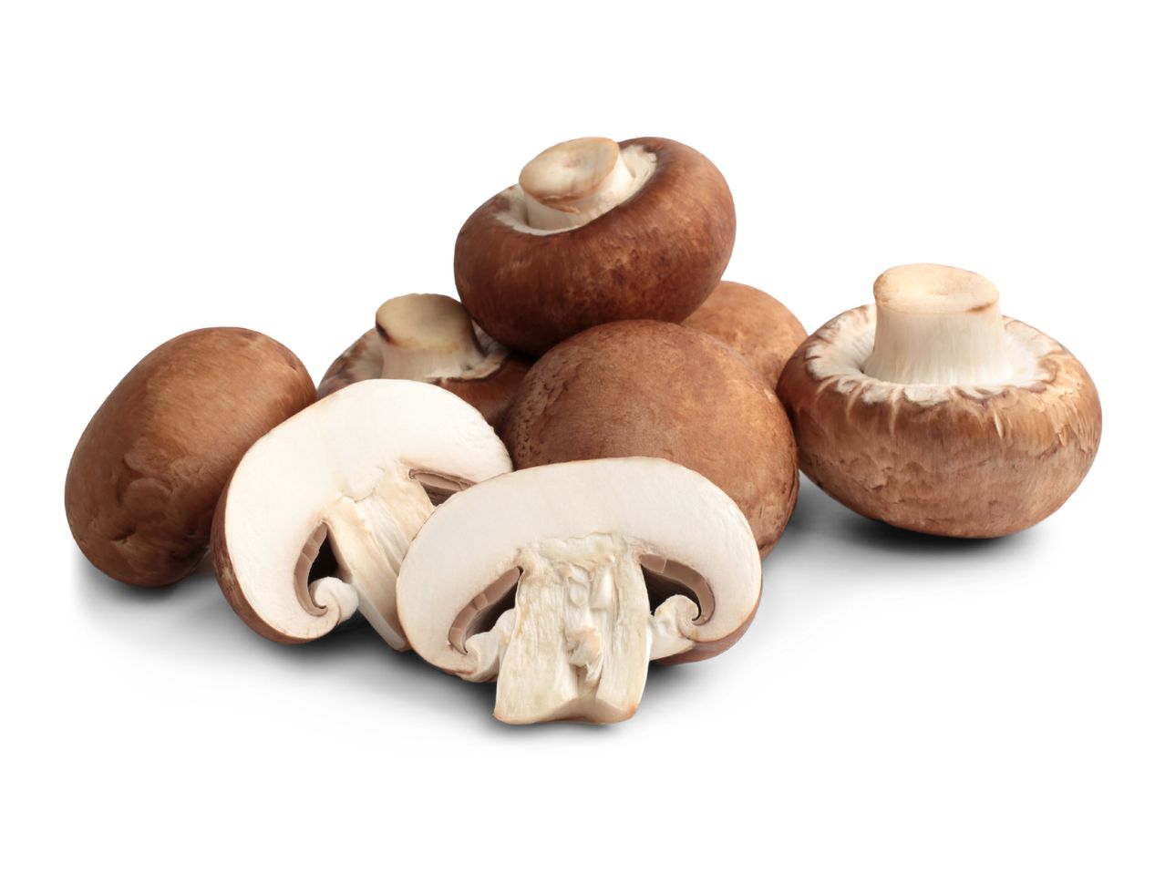 Fresh brown mushrooms, whole and sliced, on a white background.