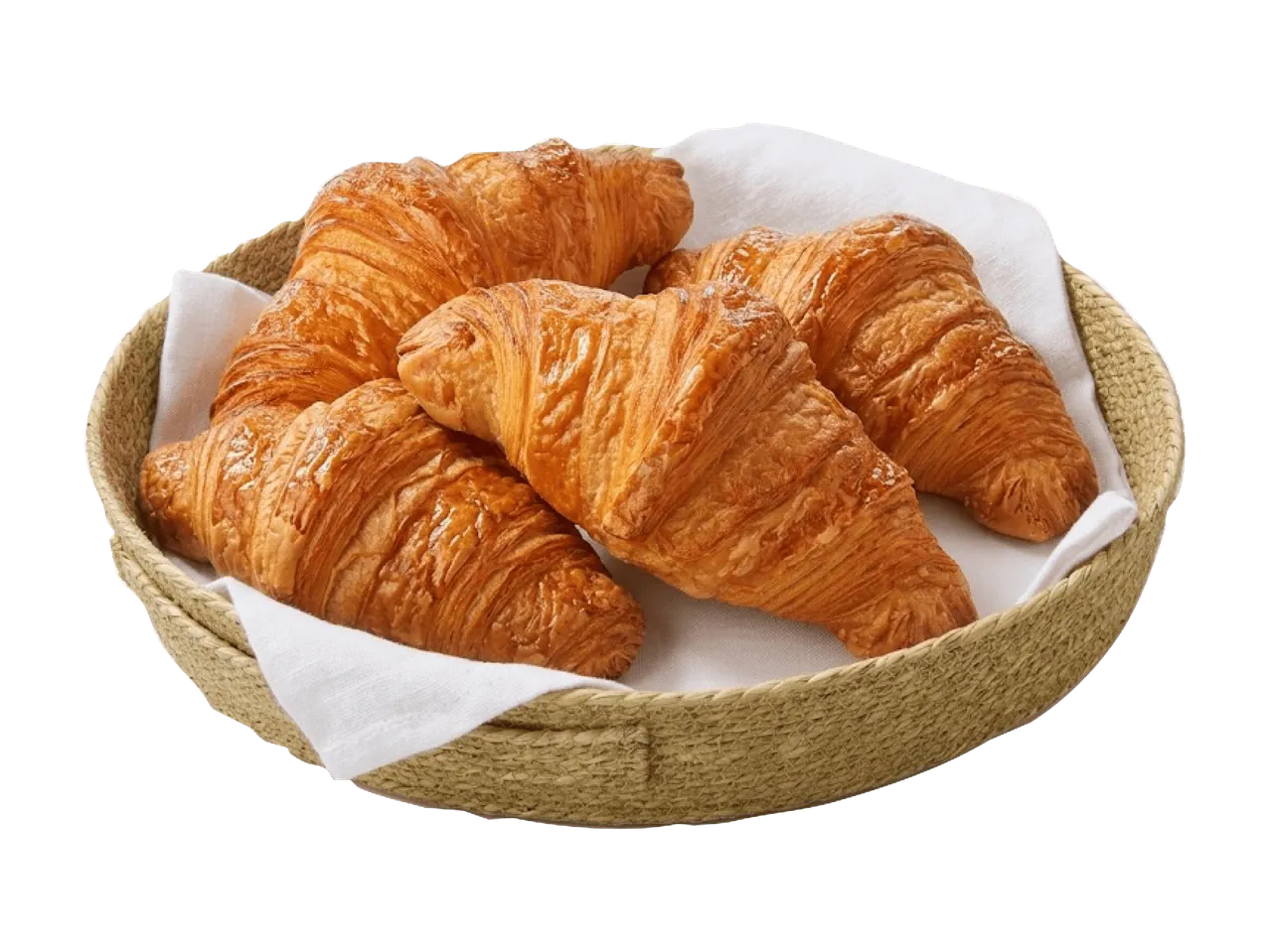Vier goldbraune, knusprige Croissants in einem geflochtenen Korb mit weißem Tuch.