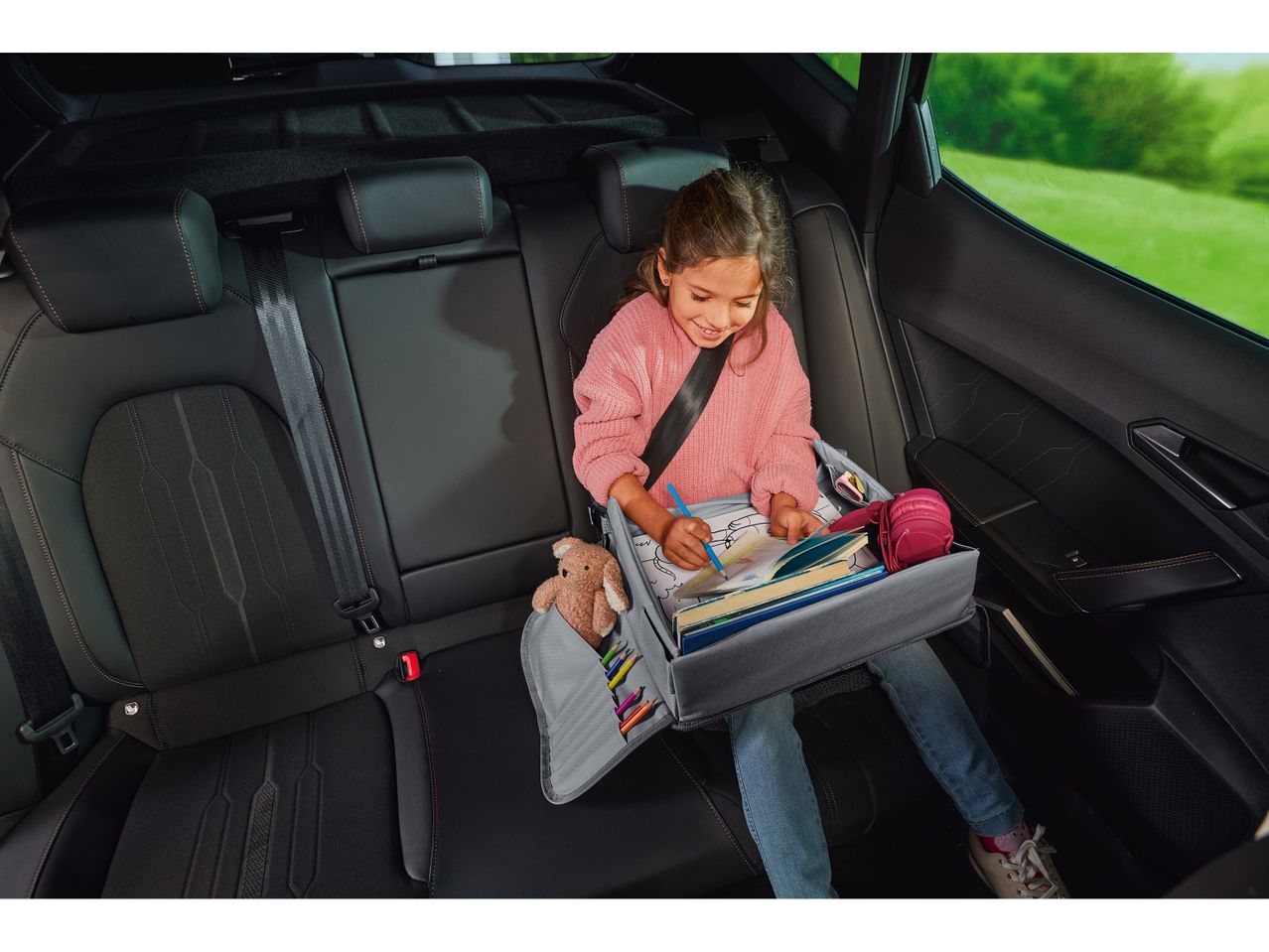Child in car seat using a ULTIMATE SPEED® Portable Travel & Play Table