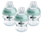 Three anti-colic baby bottles with light green components and clear bodies.