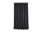 Black waffle weave shower curtain hanging from a silver rod with hooks.