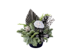 Funeral arrangement featuring fir branches, pinecones, and a decorative cross.