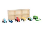 Wooden toy farm vehicles, including tractors, a hay wagon, and a combine harvester, with a storage box.