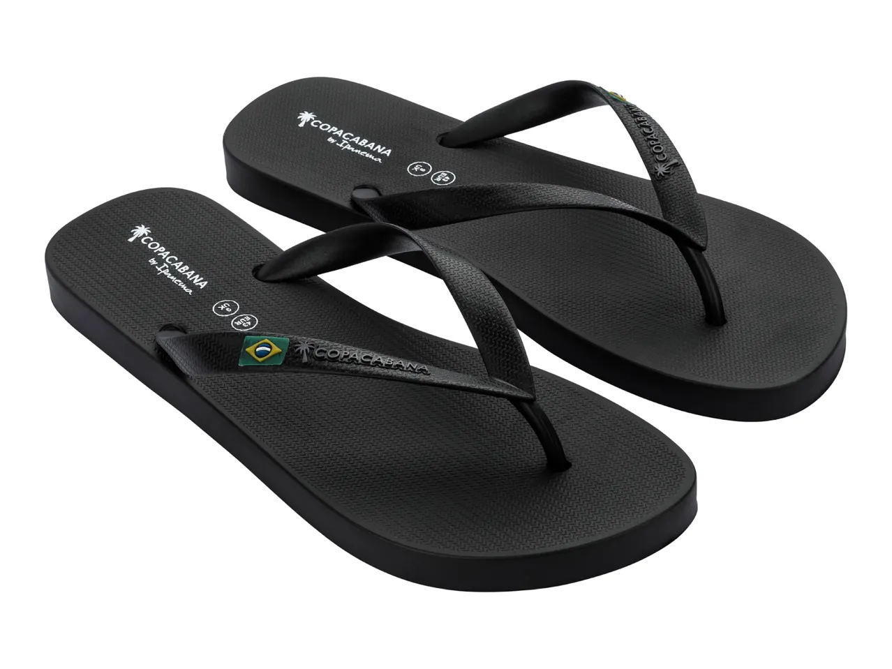 Pair of black flip-flops with a palm tree logo and a small Brazilian flag on the strap.