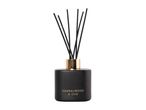 Sandalwood & Oud reed diffuser in a matte black bottle with a gold collar