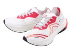 Pair of white running shoes with red and orange accents and black outsoles.