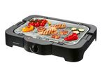 Electric grill with grilled meat and vegetables like tomatoes, peppers, and zucchini.