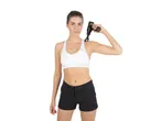Woman using a Vitalmaxx mini massage gun on her shoulder.
