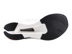 Underside of a white running shoe with black sole patterns and a visible carbon plate.