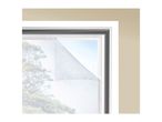 Window with a white insect screen partially peeled back, revealing a blurred outdoor view.
