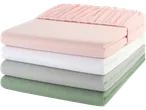 Pastel fitted sheets: pink, white, grey, and green.