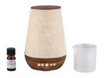 Aroma diffuser with fabric cover, measuring cup, and essential oil bottle