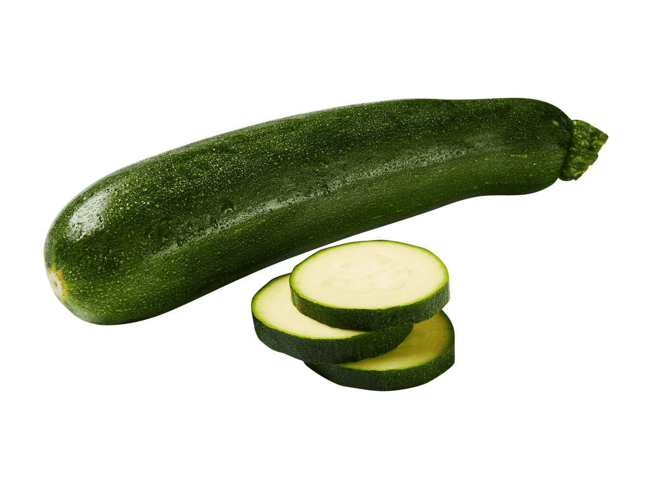 Trois courgettes vertes fraîches empilées sur un fond noir.