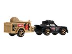 Hot Wheels black car with a tan trailer, featuring a spare tire and gas can.