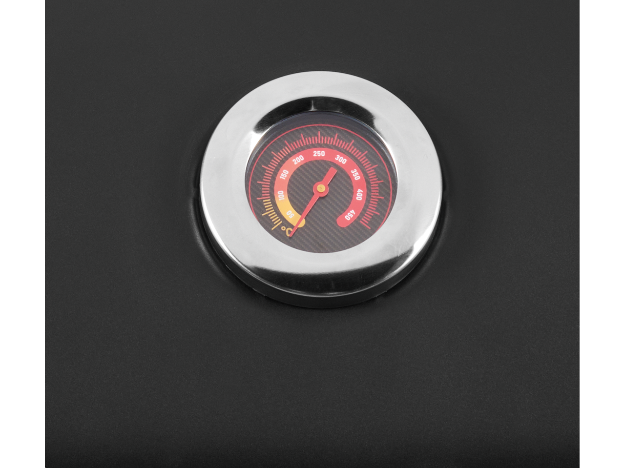 Close-up of a Grillmeister grill thermometer showing a temperature of approximately 220°C.