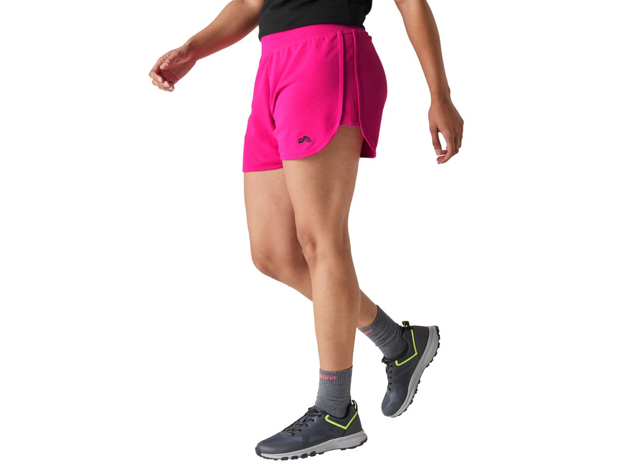Person in pink running shorts and gray athletic shoes