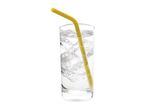 Glass of sparkling water with ice cubes and a yellow straw