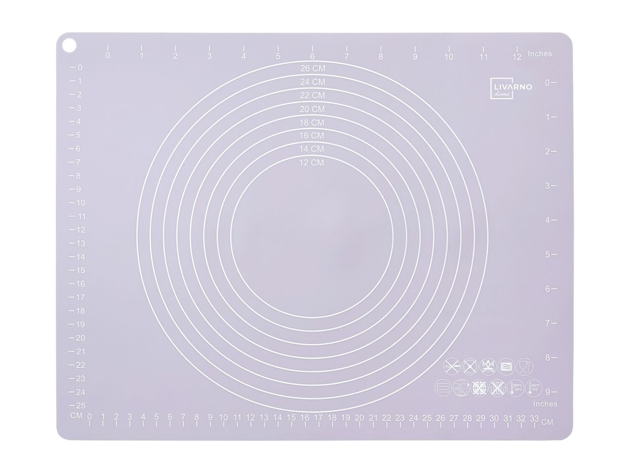 A white silicone baking mat with concentric circles for rolling dough.