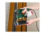 Person holding a Parkside sander with a dust collection box and a sanding pad.
